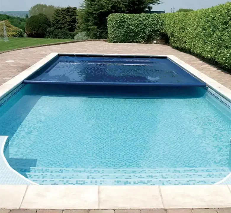 Picture of an inground pool with a Coverstar pool cover