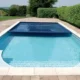 Picture of an inground pool with a Coverstar pool cover