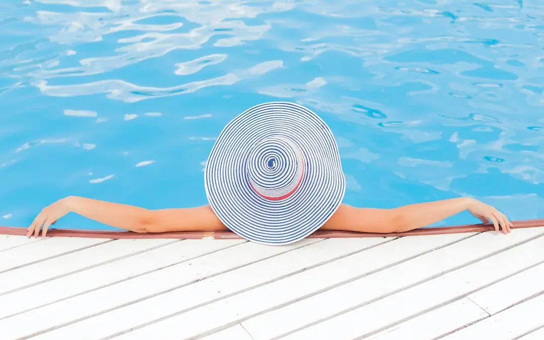 A lady is relaxing in a fiberglass pool in Raleigh, NC.