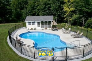 inground fiberglass pool with pool house and patio furniture