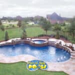 inground fiberglass pool with spillover spa and bubblers