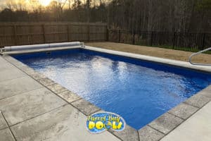 inground fiberglass pool with automatic pool cover