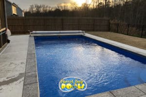 inground fiberglass pool with automatic pool cover