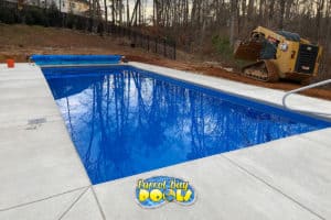 inground fiberglass pool with pool cover
