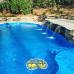 inground fiberglass pool with triple waterfall ledge