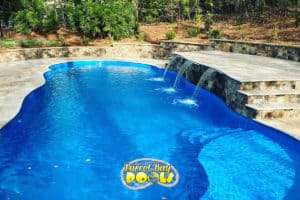 inground fiberglass pool with triple waterfall ledge