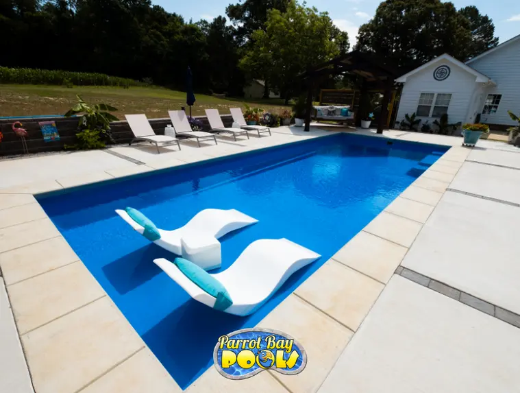 River M35 inground fiberglass pool with tanning ledge pool installation by Parrot Bay Pools in North Carolina