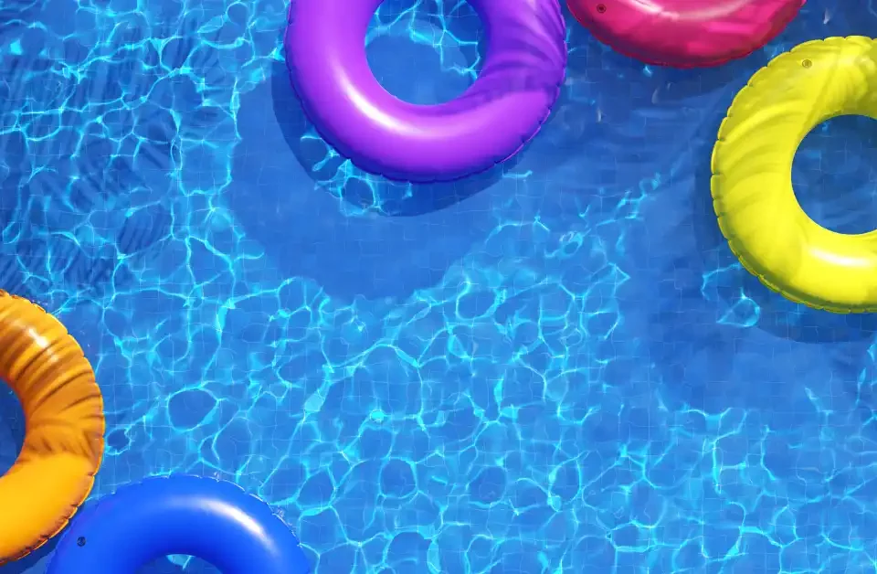 Picture of pool tubes floating in a swimming pool for the article about vinyl vs fiberglass pools