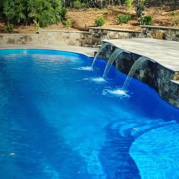 Custom fiberglass swimming pool in North Carolina with water feature
