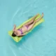 Picture of a person floating in a clean pool after learning how to fix, 