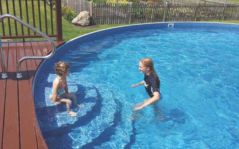 Photo of kids in semi-inground pool.